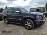 2011 Chevrolet Tahoe LTZ z VIN 1GNSKCE03BR218789, wystawiony jako Copart lot #71005005 z przebiegiem 148 342 mil mil oraz Czysty tytuł • Clean title. Historia ofert i sprzedaży dostępna na DreamBid. Obrazek 4.