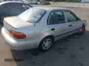 2001 Chevrolet Prizm с VIN 1Y1SK52811Z447352, выставлен на аукционе Copart как лот 73916394 с пробегом 89 265 миль миль и Списание • Salvage title. История ставок и продаж доступна на DreamBid. Изображение 3.