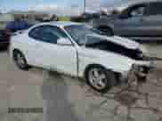 2000 Hyundai Tiburon с VIN KMHJG35F9YU191917, выставлен на аукционе Copart как лот 79629394 с пробегом 179 948 миль миль и Списание • Salvage title. История ставок и продаж доступна на DreamBid. Изображение 4.