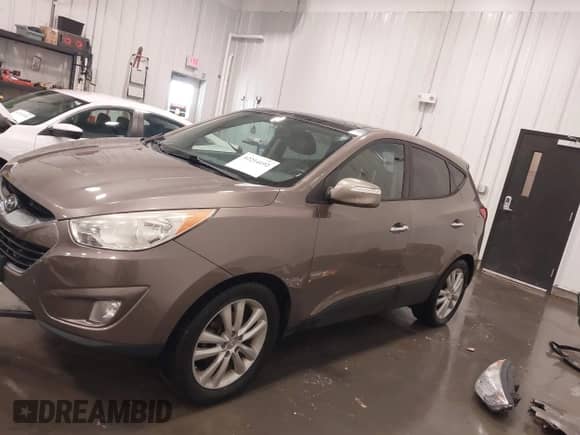 2013 Hyundai Tucson GLS with VIN KM8JU3AC0DU563398, listed as a IAAI auction lot 42214192 with 141,871 mi miles and . Bid and sale history available at DreamBid. Image 15.