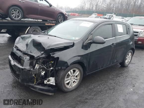 2012 Chevrolet Sonic LT with VIN 1G1JD6SH4C4176084, listed as a IAAI auction lot 41479847 with 57,690 mi miles and . Bid and sale history available at DreamBid. Image 2.