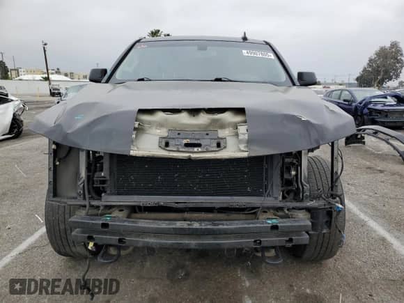 2015 Chevrolet Tahoe with VIN 1GNSK4EC1FR674022, listed as a Copart auction lot 49907805 with 157,879 mi miles and Salvage title. Bid and sale history available at DreamBid. Image 5.