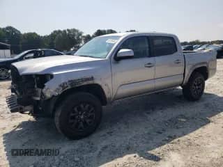 2021 Toyota Tacoma SR5 with VIN 5TFAZ5CN2MX110592, listed as a Copart auction lot 80720485 with 98,823 mi miles and Salvage title. Bid and sale history available at DreamBid. Image 1.