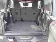 2021 Jeep Wrangler Unlimited Willys with VIN 1C4HJXDG2MW646904, listed as a IAAI auction lot 42267506 with 55,530 mi miles and . Bid and sale history available at DreamBid. Image 12.