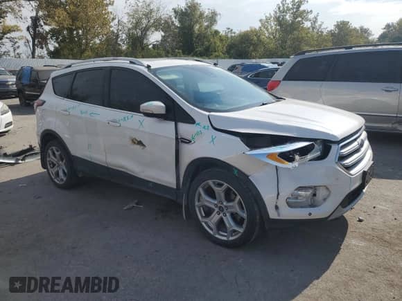 2017 Ford Escape Titanium z VIN 1FMCU9J94HUA87548, wystawiony jako Copart lot #82508955 z przebiegiem 114 702 mil mil oraz Szkoda całkowita • Salvage title. Historia ofert i sprzedaży dostępna na DreamBid. Obrazek 4.