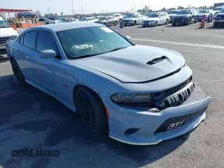 2021 Dodge Charger Scat Pack z VIN 2C3CDXGJ7MH594777, wystawiony jako IAAI lot #43044838 z przebiegiem 75 520 mil mil oraz . Historia ofert i sprzedaży dostępna na DreamBid. Obrazek 1.