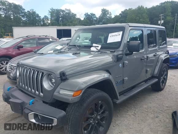 2023 Jeep Wrangler Sahara with VIN 1C4JJXP67PW641660, listed as a IAAI auction lot 43045618 with 53,182 mi miles and . Bid and sale history available at DreamBid. Image 2.