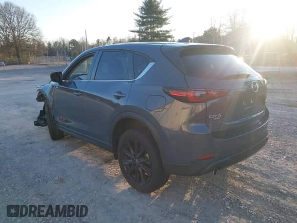 2022 Mazda CX-5 S Carbon Edition z VIN JM3KFBCM3N0537011, wystawiony jako IAAI lot #41472429 z przebiegiem 31 498 mil mil oraz . Historia ofert i sprzedaży dostępna na DreamBid. Obrazek 3.