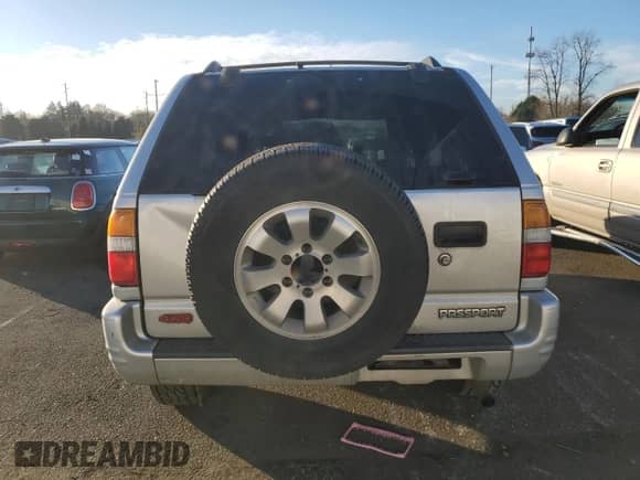 1998 Honda Passport LX with VIN 4S6CM58W0W4404170, listed as a Copart auction lot 83777484 with 181,140 mi miles and Salvage title. Bid and sale history available at DreamBid. Image 6.