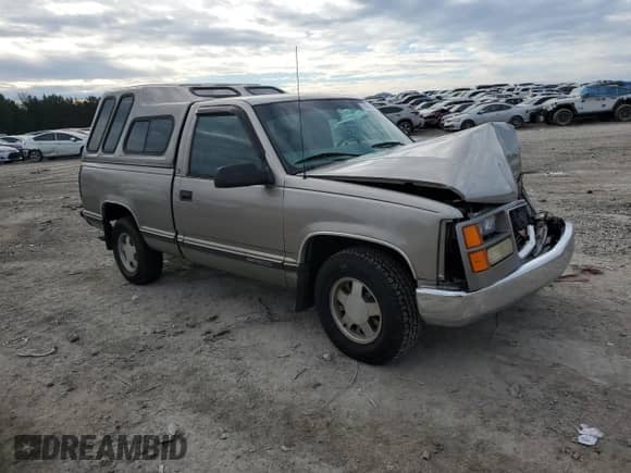 1998 GMC Sierra 1500 z VIN 1GTEC14W0WZ526005, wystawiony jako Copart lot #86539824 z przebiegiem 206 094 mil mil oraz Czysty tytuł • Clean title. Historia ofert i sprzedaży dostępna na DreamBid. Obrazek 4.