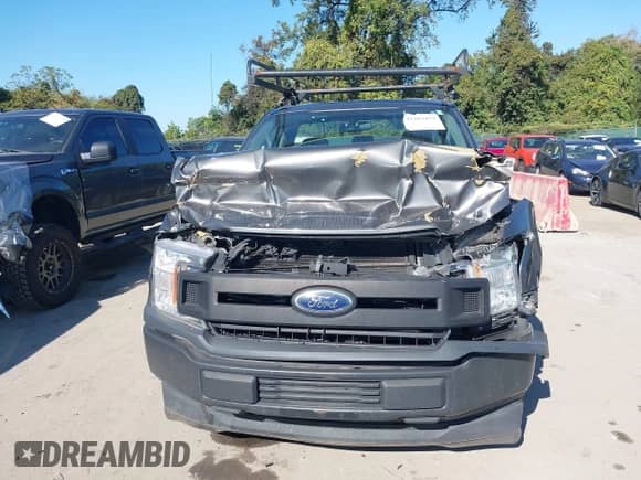 2018 Ford F-150 XL z VIN 1FTMF1CB8JKC19801, wystawiony jako IAAI lot #43383459 z przebiegiem 138 363 mil mil oraz . Historia ofert i sprzedaży dostępna na DreamBid. Obrazek 12.