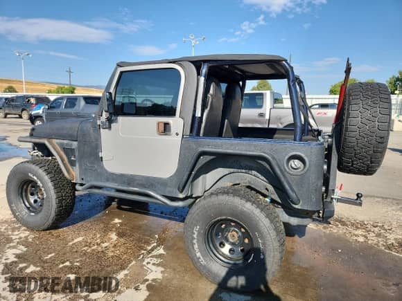 1997 Jeep Wrangler Sport with VIN 1J4FY19SXVP483096, listed as a Copart auction lot 71246695 with 261,698 mi miles and Salvage title. Bid and sale history available at DreamBid. Image 2.