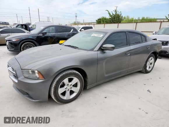 2012 Dodge Charger SE with VIN 2C3CDXBG1CH153365, listed as a Copart auction lot 67210685 with 127,914 mi miles and Salvage title. Bid and sale history available at DreamBid. Image 1.