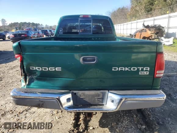 2004 Dodge Dakota SLT z VIN 1D7GL42N24S597352, wystawiony jako Copart lot #85659744 z przebiegiem 140 271 mil mil oraz Czysty tytuł • Clean title. Historia ofert i sprzedaży dostępna na DreamBid. Obrazek 6.