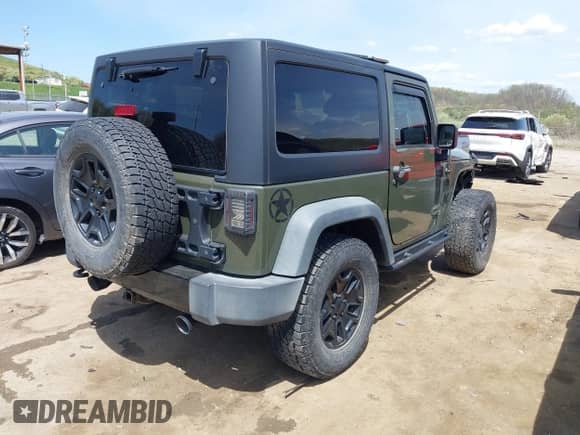 2015 Jeep Wrangler Sport with VIN 1C4AJWAG1FL714131, listed as a IAAI auction lot 42112376 with 81,998 mi miles and . Bid and sale history available at DreamBid. Image 4.