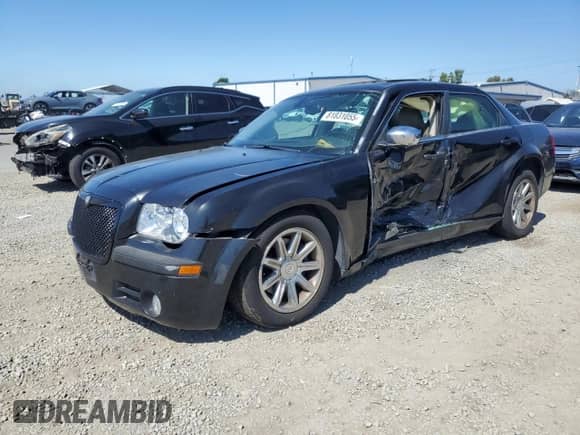 2005 Chrysler 300 C with VIN 2C3AA63H25H150558, listed as a Copart auction lot 81831055 with 128,748 mi miles and Salvage title. Bid and sale history available at DreamBid. Image 1.