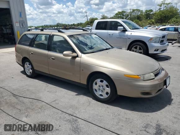 2000 Saturn LW with VIN 1G8JW82R7YY625810, listed as a Copart auction lot 68722285 with 125,702 mi miles and Salvage title. Bid and sale history available at DreamBid. Image 4.