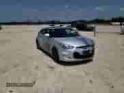 2013 Hyundai Veloster w/Black Int z VIN KMHTC6AD9DU147646, wystawiony jako Copart lot #58495585 z przebiegiem 121 781 mil mil oraz Szkoda całkowita • Salvage title. Historia ofert i sprzedaży dostępna na DreamBid. Obrazek 14.