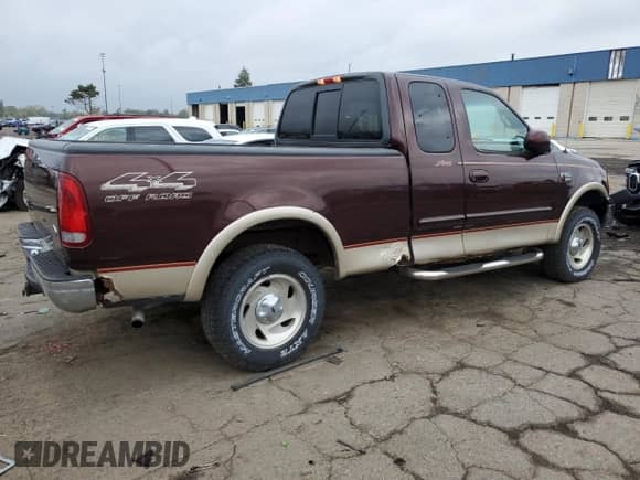 2000 Ford F-150 XL z VIN 1FTRX18L2YNA84926, wystawiony jako Copart lot #81187235 z przebiegiem Nie podano mil oraz Szkoda całkowita • Salvage title. Historia ofert i sprzedaży dostępna na DreamBid. Obrazek 3.