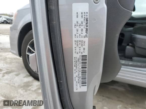 2015 Dodge Grand Caravan SXT with VIN 2C4RDGCG4FR605473, listed as a Copart auction lot 52689925 with 179,966 mi miles and Salvage title. Bid and sale history available at DreamBid. Image 13.