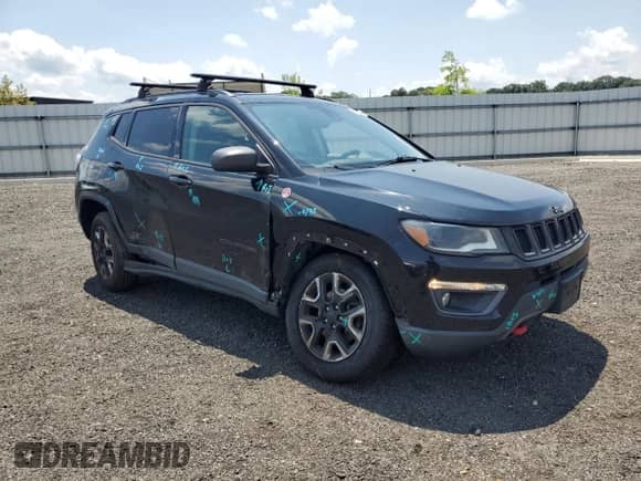2017 Jeep Compass Trailhawk with VIN 3C4NJDDB6HT631761, listed as a Copart auction lot 62759555 with 94,528 mi miles and Salvage title. Bid and sale history available at DreamBid. Image 4.