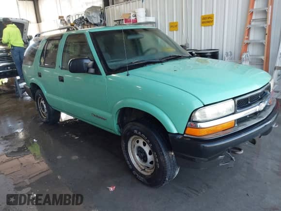 2003 Chevrolet Blazer LS with VIN 1GNDT13XX3K167585, listed as a IAAI auction lot 43350748 with 157,980 mi miles and . Bid and sale history available at DreamBid. Image 1.