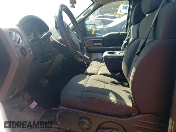 2007 Ford F-150 XL with VIN 1FTRF14V47KC54200, listed as a Copart auction lot 69243983 with 164,147 mi miles and Salvage title. Bid and sale history available at DreamBid. Image 7.