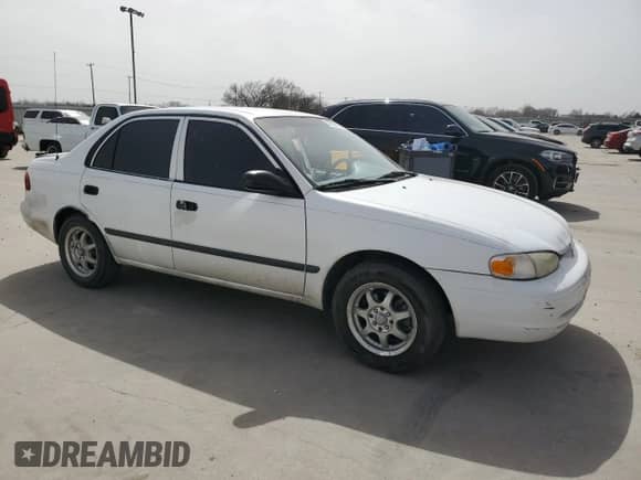 2002 Chevrolet Prizm z VIN 1Y1SK528X2Z409412, wystawiony jako Copart lot #47899055 z przebiegiem 99 262 mil mil oraz Czysty tytuł • Clean title. Historia ofert i sprzedaży dostępna na DreamBid. Obrazek 4.