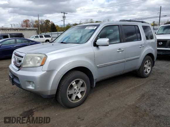 2010 Honda Pilot Touring с VIN 5FNYF4H9XAB021792, выставлен на аукционе Copart как лот 89511745 с пробегом 233 599 миль миль и Списание • Salvage title. История ставок и продаж доступна на DreamBid. Изображение 1.