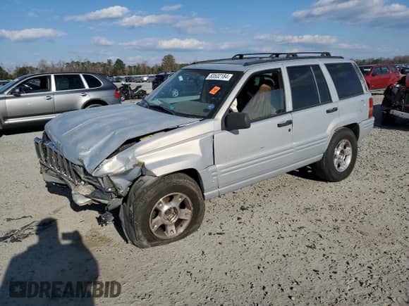 1998 Jeep Grand Cherokee with VIN 1J4GX48Y7WC216585, listed as a Copart auction lot 83532184 with 144,739 mi miles and Salvage title. Bid and sale history available at DreamBid. Image 1.