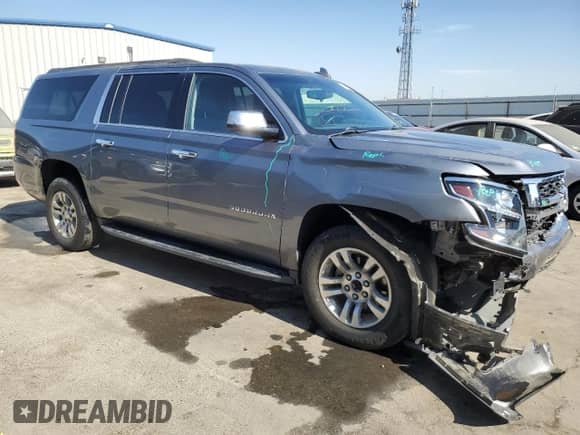 2019 Chevrolet Suburban LS with VIN 1GNSCGKC6KR209877, listed as a Copart auction lot 77125534 with 67,591 mi miles and Salvage title. Bid and sale history available at DreamBid. Image 4.