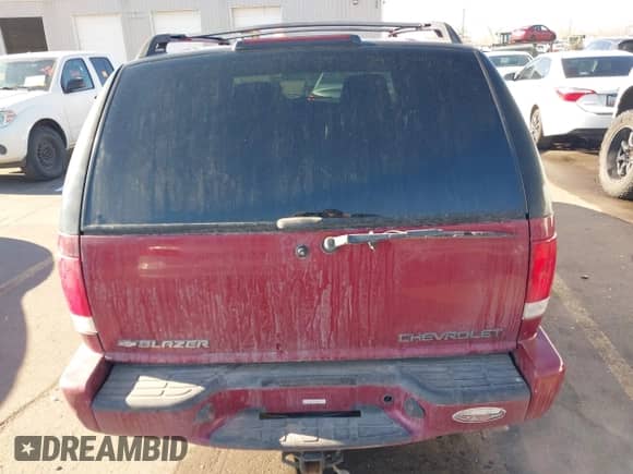 2002 Chevrolet Blazer LS z VIN 1GNCS13WX2K197447, wystawiony jako IAAI lot #41336365 z przebiegiem 196 555 mil mil oraz . Historia ofert i sprzedaży dostępna na DreamBid. Obrazek 16.