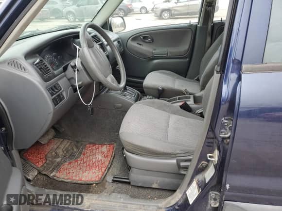 2000 Chevrolet Tracker with VIN 2CNBJ13C0Y6917889, listed as a Copart auction lot 42703105 with Not provided miles and Salvage title. Bid and sale history available at DreamBid. Image 7.