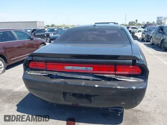 2013 Dodge Challenger SXT with VIN 2C3CDYAG9DH708717, listed as a IAAI auction lot 41990705 with 92,784 mi miles and . Bid and sale history available at DreamBid. Image 16.