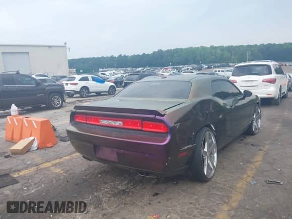 2013 Dodge Challenger SXT with VIN 2C3CDYAG0DH570095, listed as a IAAI auction lot 42282130 with 191,728 mi miles and . Bid and sale history available at DreamBid. Image 4.