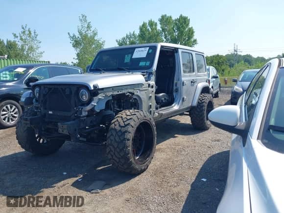 2021 Jeep Wrangler Unlimited Sahara High Altitude with VIN 1C4HJXENXMW670526, listed as a IAAI auction lot 42868629 with 26,407 mi miles and . Bid and sale history available at DreamBid. Image 18.