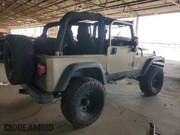 2004 Jeep Wrangler Sport z VIN 1J4FA49S14P768676, wystawiony jako Copart lot #69976745 z przebiegiem 165 894 mil mil oraz Szkoda całkowita • Salvage title. Historia ofert i sprzedaży dostępna na DreamBid. Obrazek 3.