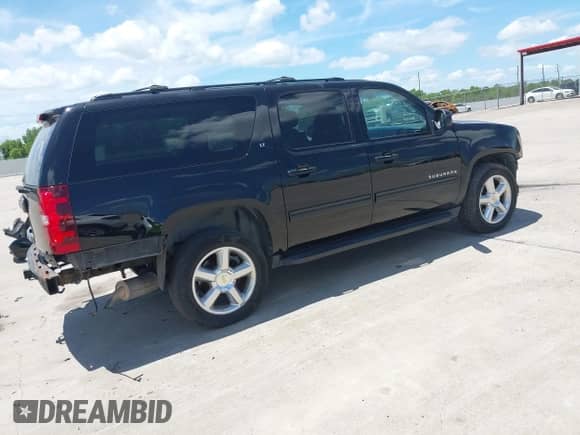 2013 Chevrolet Suburban LT with VIN 1GNSKJE71DR168382, listed as a IAAI auction lot 42821206 with 209,210 mi miles and . Bid and sale history available at DreamBid. Image 4.