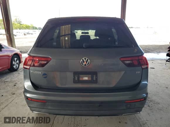 2018 Volkswagen Tiguan S с VIN 3VV1B7AX4JM055103, выставлен на аукционе Copart как лот 82042935 с пробегом 111 715 миль миль и Списание • Salvage title. История ставок и продаж доступна на DreamBid. Изображение 6.