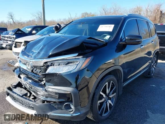 2020 Honda Pilot Touring 7-Passenger z VIN 5FNYF5H64LB006073, wystawiony jako IAAI lot #41750282 z przebiegiem 73 214 mil mil oraz . Historia ofert i sprzedaży dostępna na DreamBid. Obrazek 17.