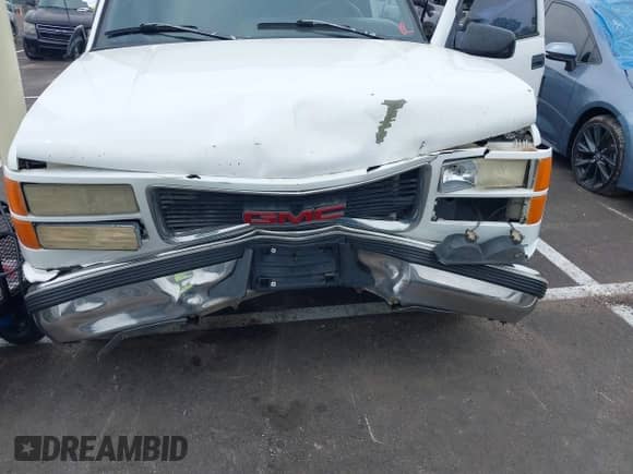 1996 GMC Sierra 1500 z VIN 2GTEC19R6T1533497, wystawiony jako IAAI lot #42258796 z przebiegiem 350 216 mil mil oraz . Historia ofert i sprzedaży dostępna na DreamBid. Obrazek 6.