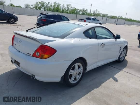 2003 Hyundai Tiburon GT с VIN KMHHN65FX3U036095, выставлен на аукционе IAAI как лот 41895465 с пробегом 179 838 миль миль и . История ставок и продаж доступна на DreamBid. Изображение 4.