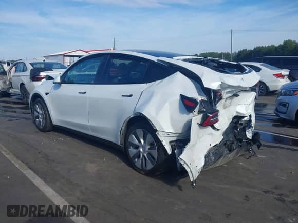 2022 Tesla Model Y Long Range z VIN 7SAYGDEEXNF418006, wystawiony jako IAAI lot #43267037 z przebiegiem 36 028 mil mil oraz . Historia ofert i sprzedaży dostępna na DreamBid. Obrazek 3.