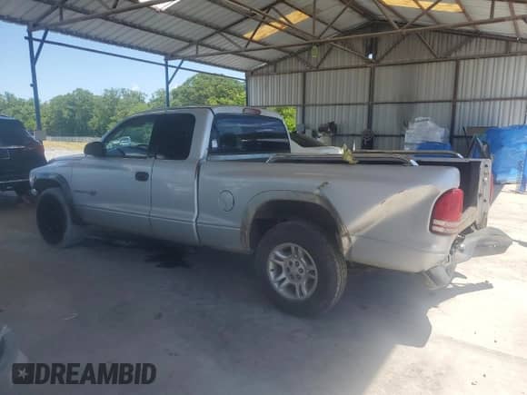 2002 Dodge Dakota с VIN 1B7GL12X32S566683, выставлен на аукционе Copart как лот 56896145 с пробегом 229 321 миль миль и Списание • Salvage title. История ставок и продаж доступна на DreamBid. Изображение 2.