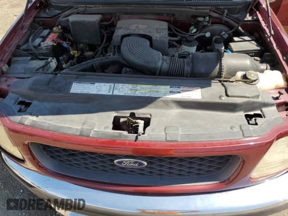 1997 Ford F-150 XL z VIN 1FTEX17L4VKC42857, wystawiony jako Copart lot #68759105 z przebiegiem 96 657 mil mil oraz Szkoda całkowita • Salvage title. Historia ofert i sprzedaży dostępna na DreamBid. Obrazek 11.