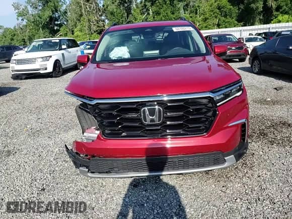 2024 Honda Pilot Touring с VIN 5FNYG2H76RB014608, выставлен на аукционе Copart как лот 64100215 с пробегом Не указан миль и Списание • Salvage title. История ставок и продаж доступна на DreamBid. Изображение 14.