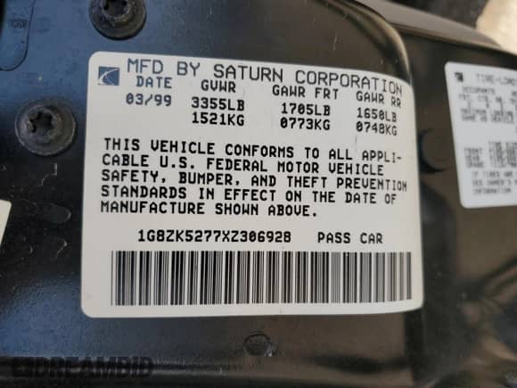 1999 Saturn SL z VIN 1G8ZK5277XZ306928, wystawiony jako Copart lot #63299615 z przebiegiem 42 474 mil mil oraz Szkoda całkowita • Salvage title. Historia ofert i sprzedaży dostępna na DreamBid. Obrazek 12.