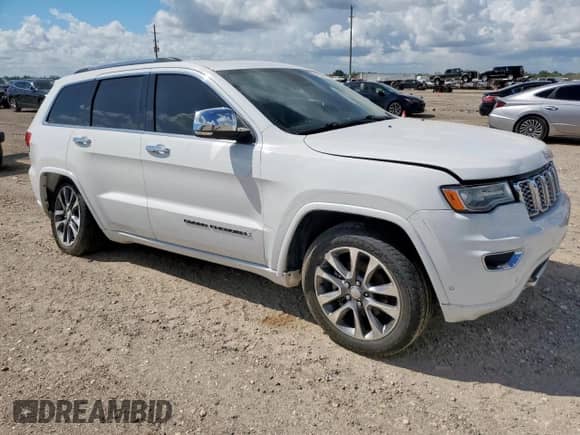 2017 Jeep Grand Cherokee Overland with VIN 1C4RJECG8HC965161, listed as a Copart auction lot 82068045 with 99,654 mi miles and Salvage title. Bid and sale history available at DreamBid. Image 4.