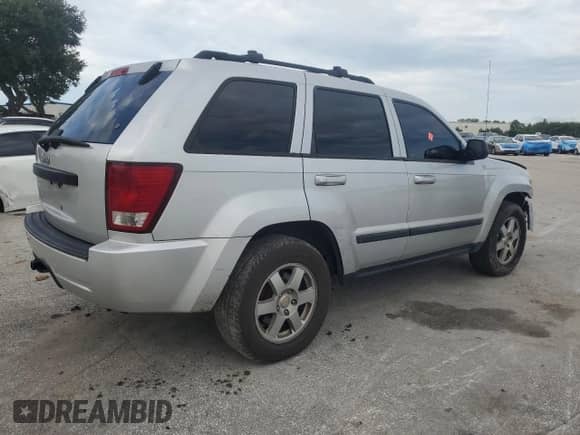 2009 Jeep Grand Cherokee Laredo with VIN 1J8GS48K39C552165, listed as a Copart auction lot 71912915 with 214,755 mi miles and Salvage title. Bid and sale history available at DreamBid. Image 3.