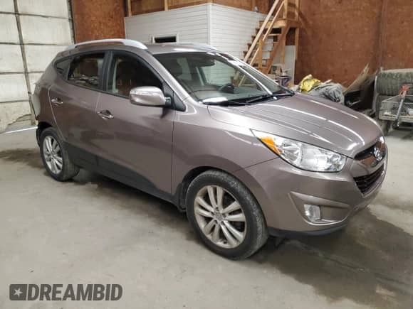 2012 Hyundai Tucson Limited с VIN KM8JUCAC5CU424284, выставлен на аукционе Copart как лот 69857205 с пробегом 116 953 миль миль и Списание • Salvage title. История ставок и продаж доступна на DreamBid. Изображение 4.